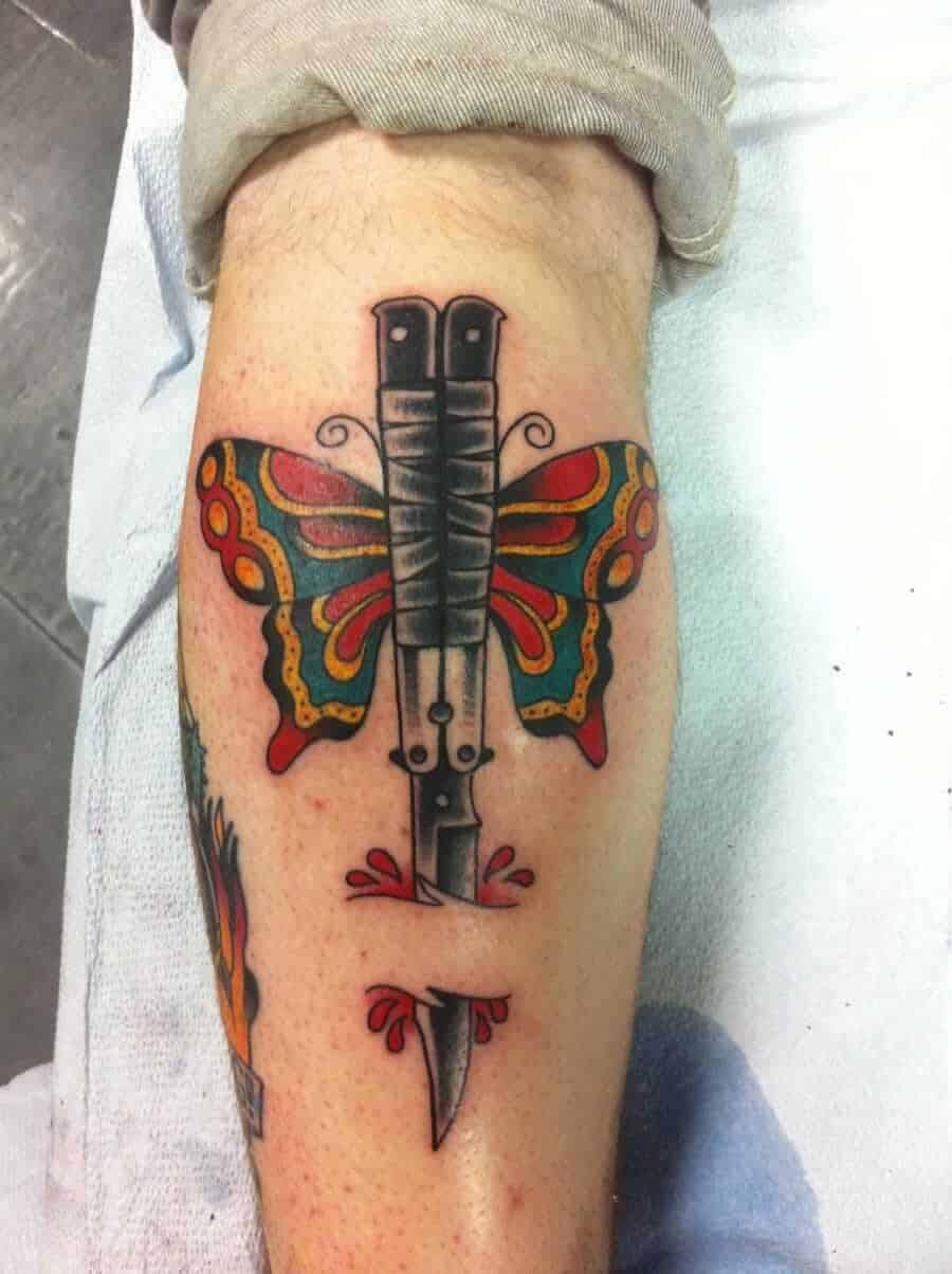 butterfly knife tattoo on leg