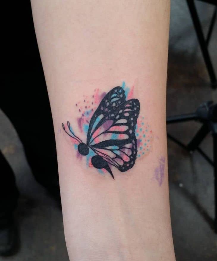 butterfly semicolon arm tattoo