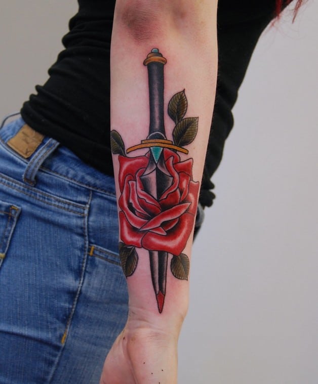 dagger and rose tattoo on arm