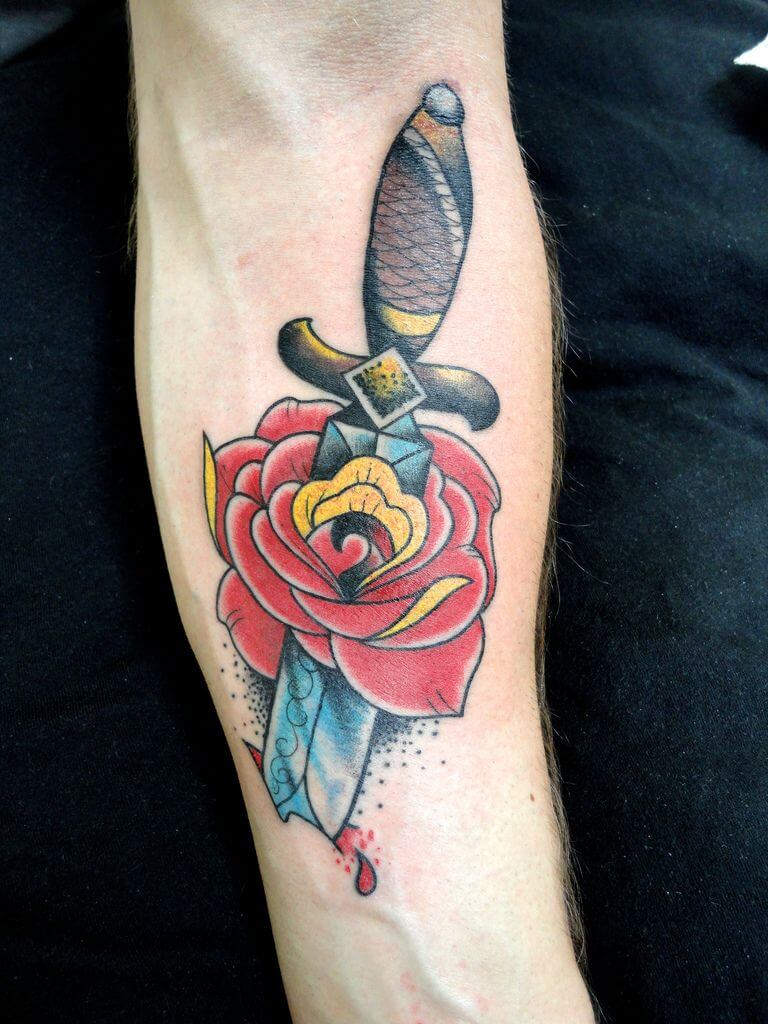 Rose stabbed with a dagger tattoo  Tattoogridnet