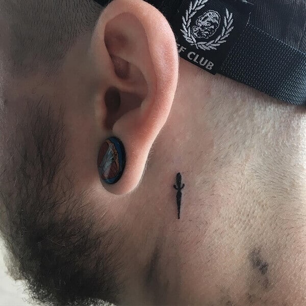 dagger ear tattoo