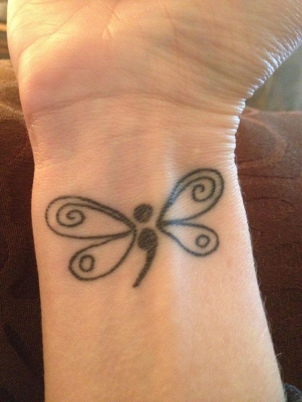dragonfly semicolon tattoo on wrist