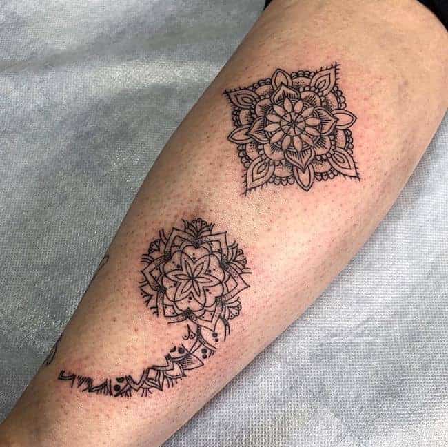 flower semicolon tattoo on arm