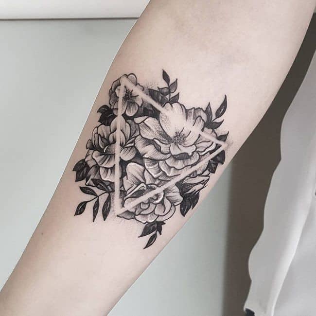 geometric hibiscus tattoo on arm