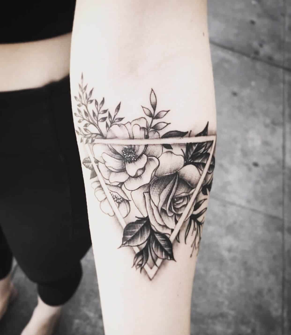 geometric hibiscus tattoo on arm