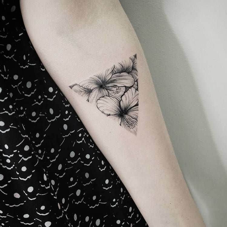 geometric hibiscus tattoo on arm