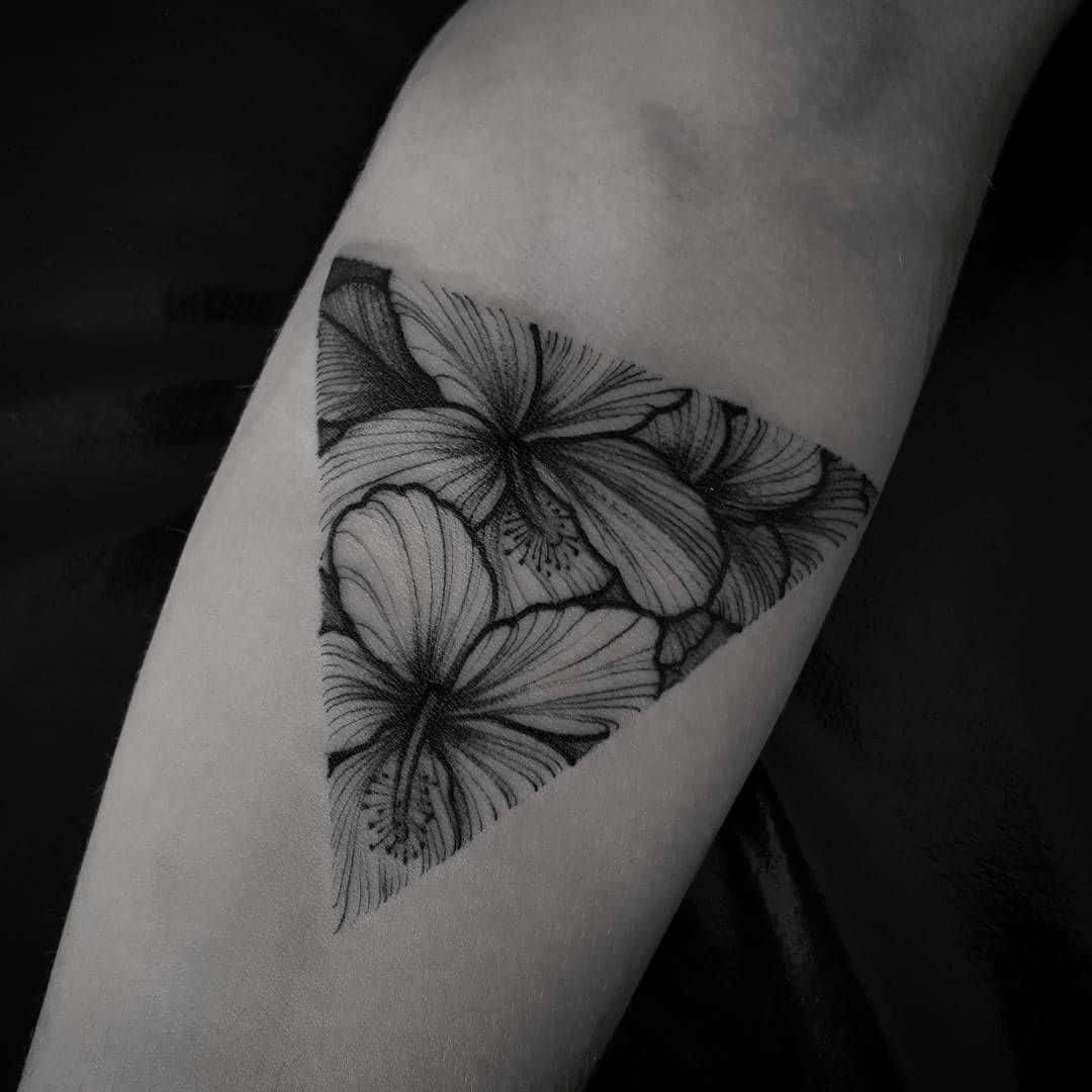 Hibiscus flower tattoo located on the tricep