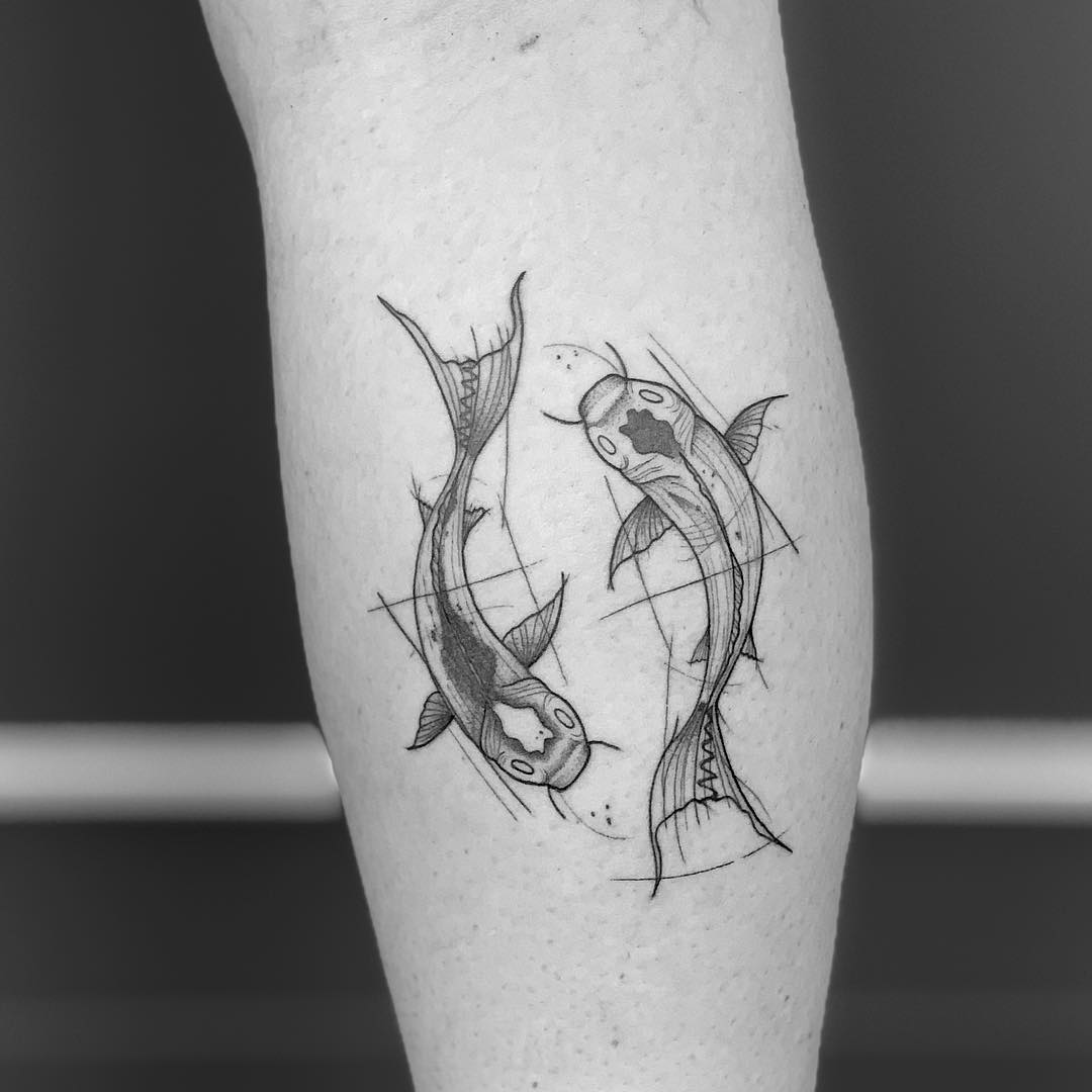 geometric sea creature tattoo on arm