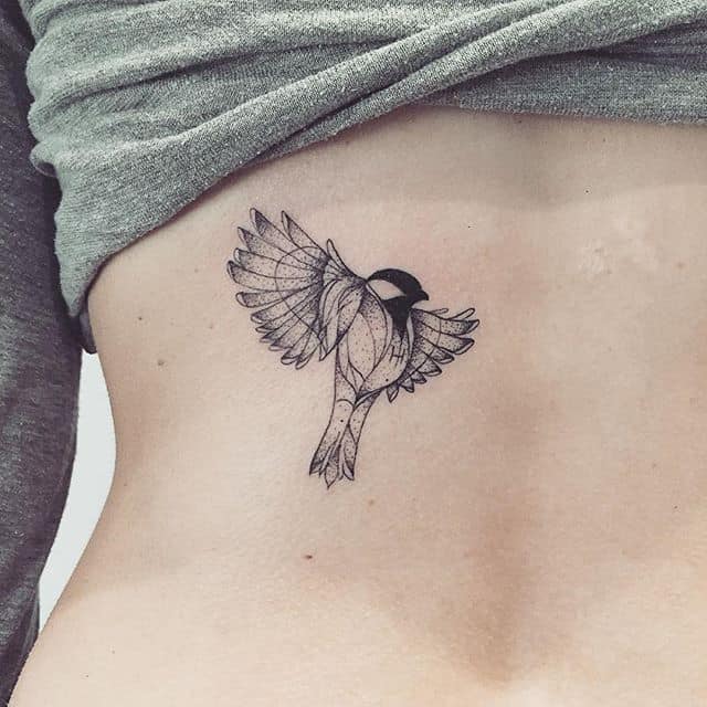 geometric sparrow tattoo on back