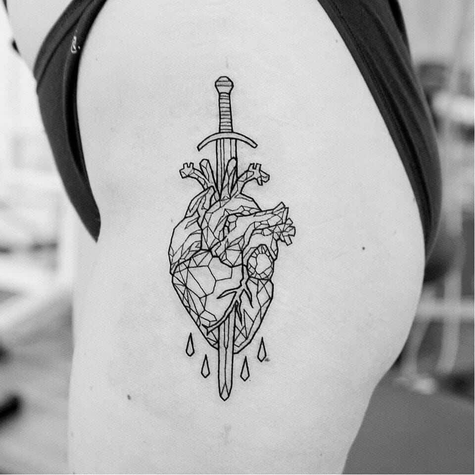 heart and dagger tattoo on thigh