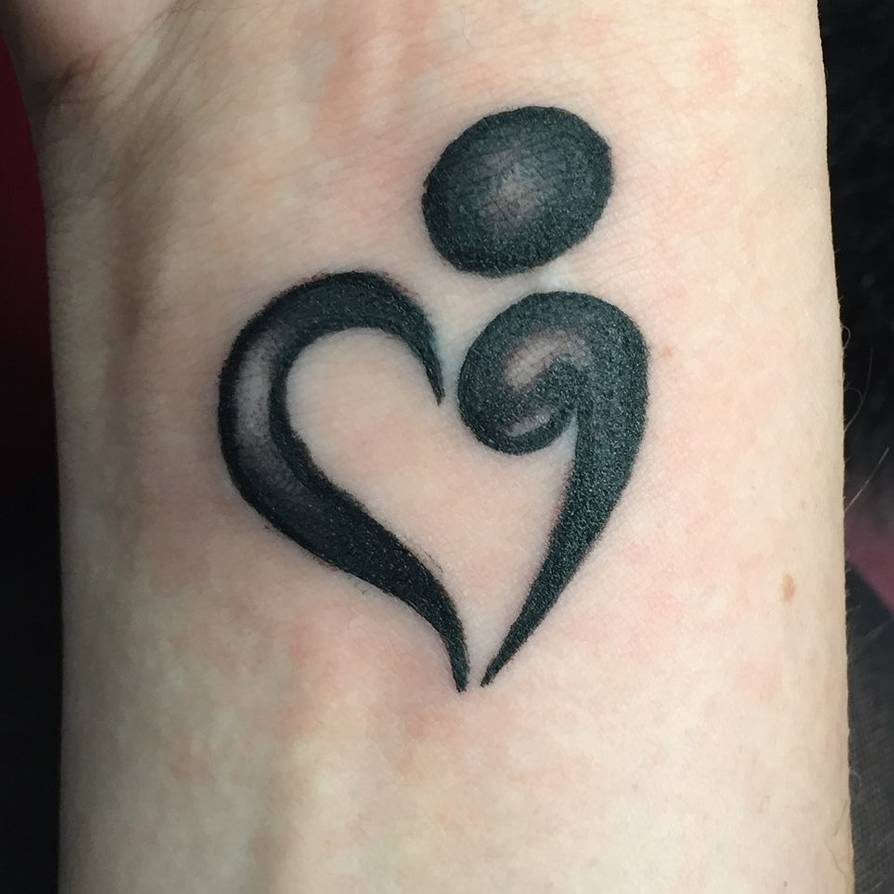 heart semicolon tattoo on wrist