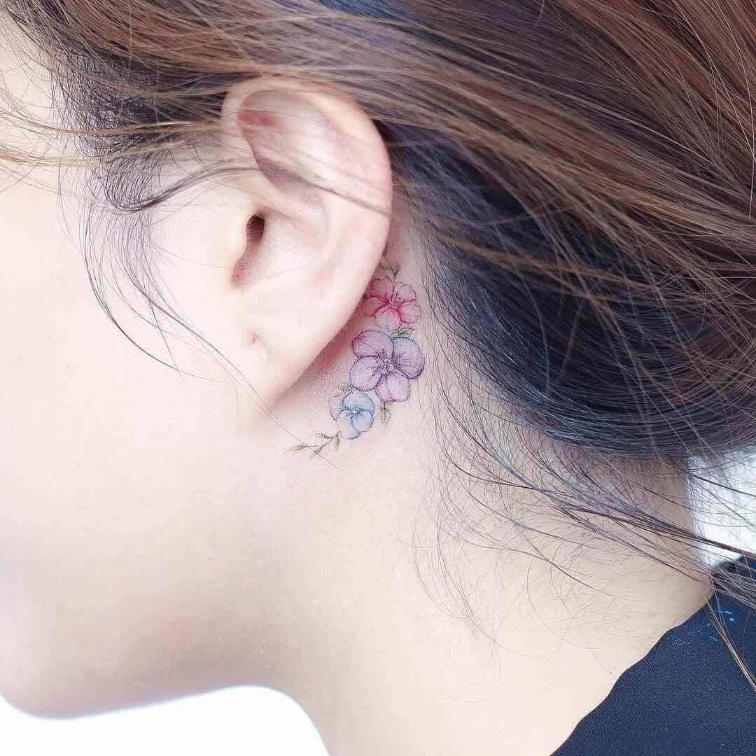 hibiscus ear tattoo