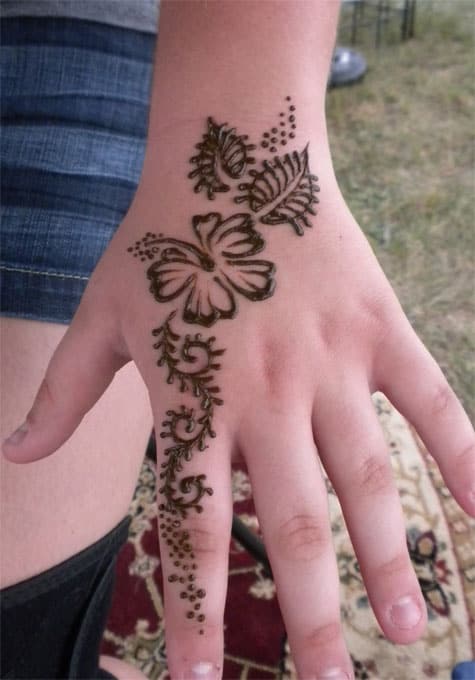 hibiscus hand tattoo