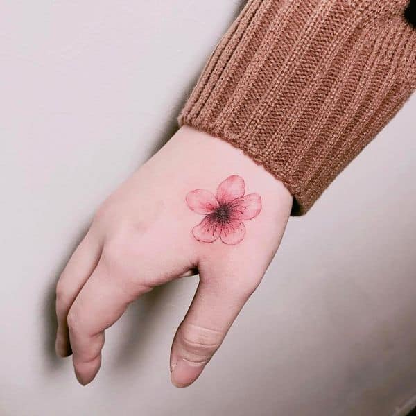 hibiscus hand tattoo