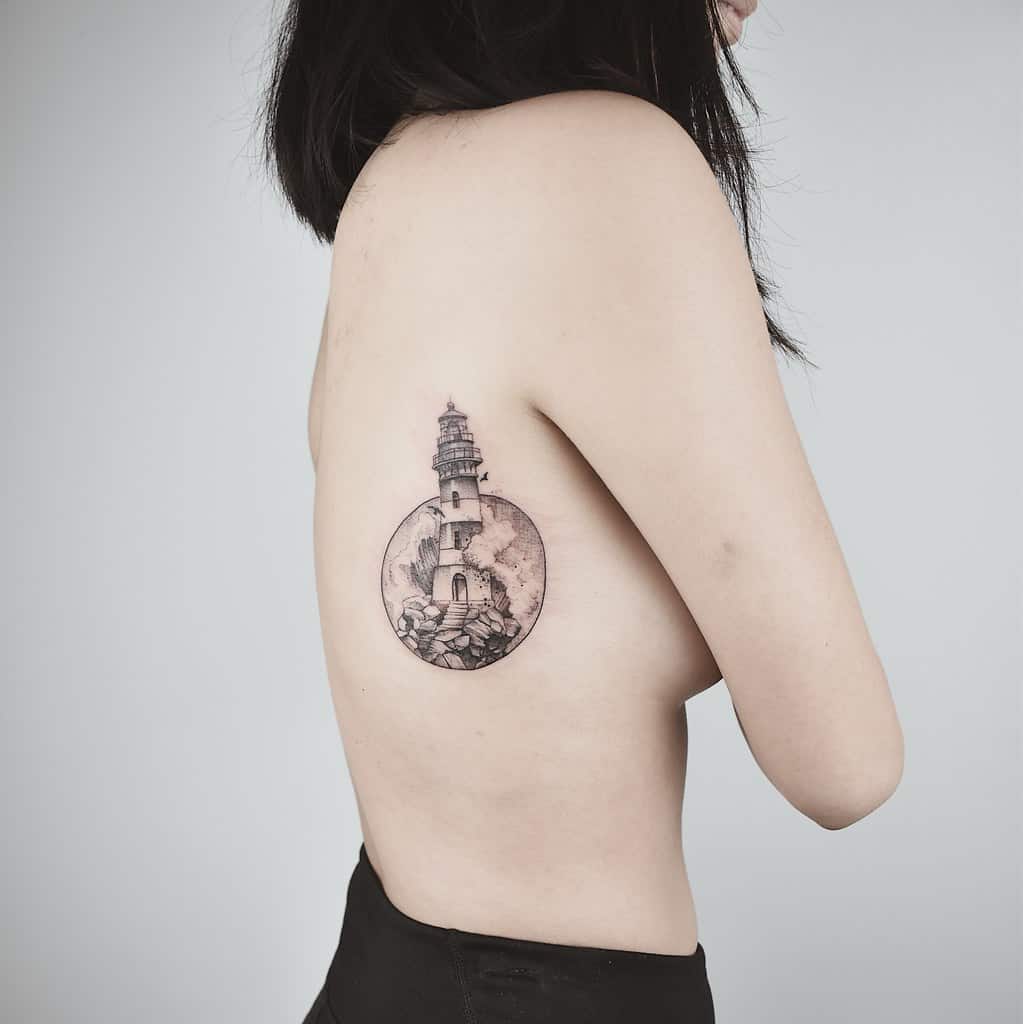lighthouse tattoo on back