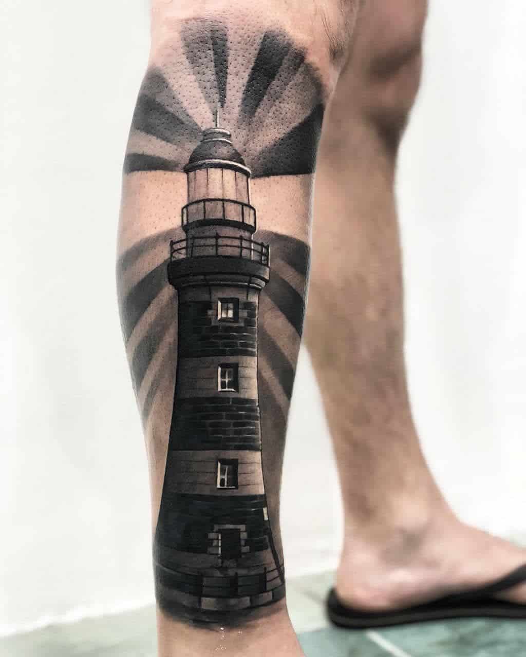 tatuagem de farol na perna