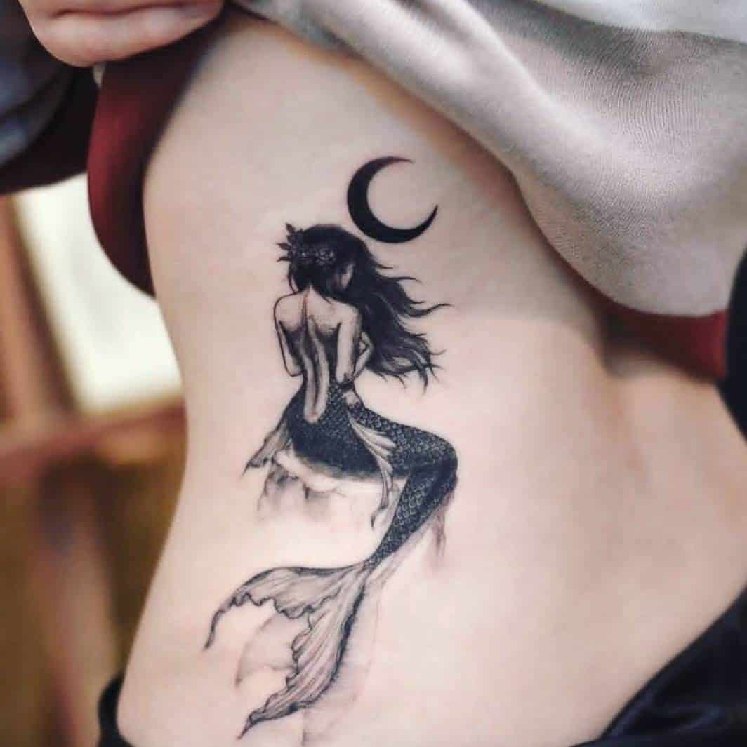 mermaid tattoo on back