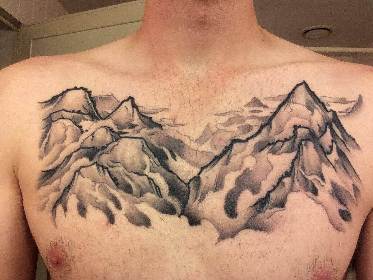 Showcase your adventurous spirit with a mountain range tattoo