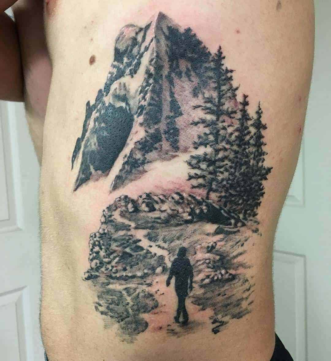 minimalist mountain tattoo ribs