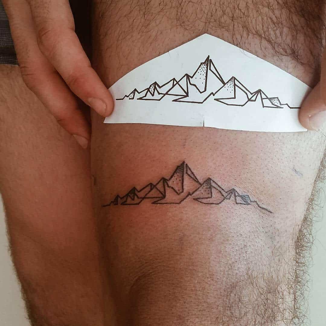 mountain thigh tattoo