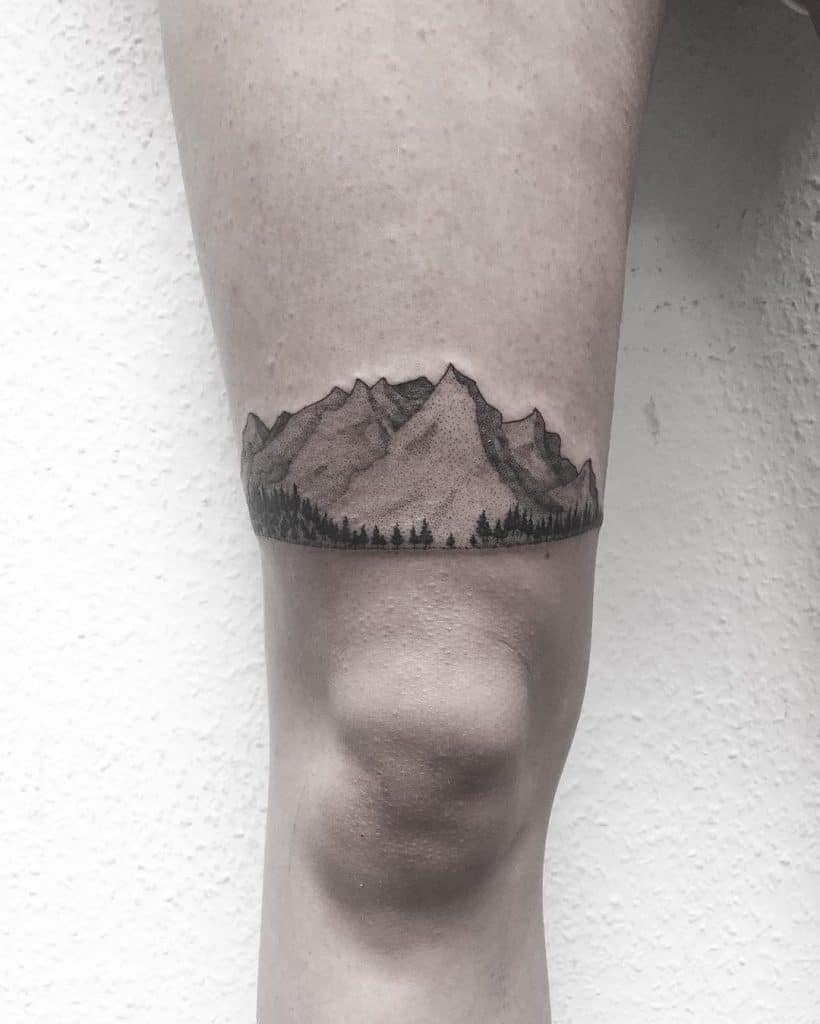 mountain thigh tattoo