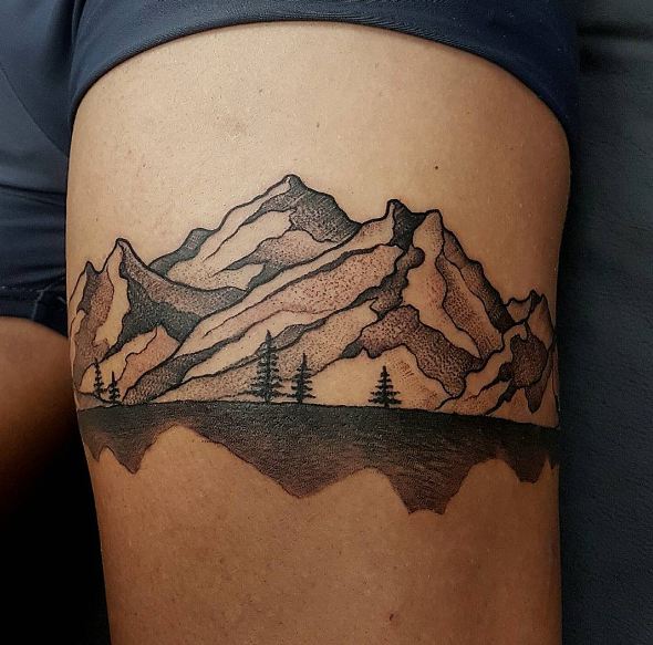 Mountains and trees tattoo on thigh  Tattoogridnet