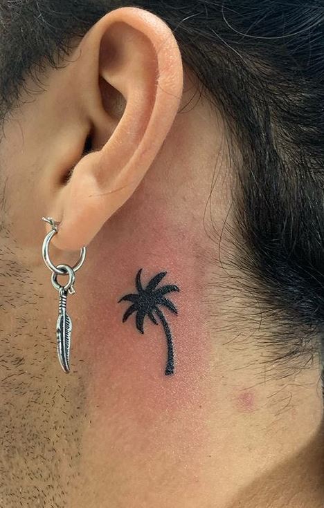 palm tree ear tattoo