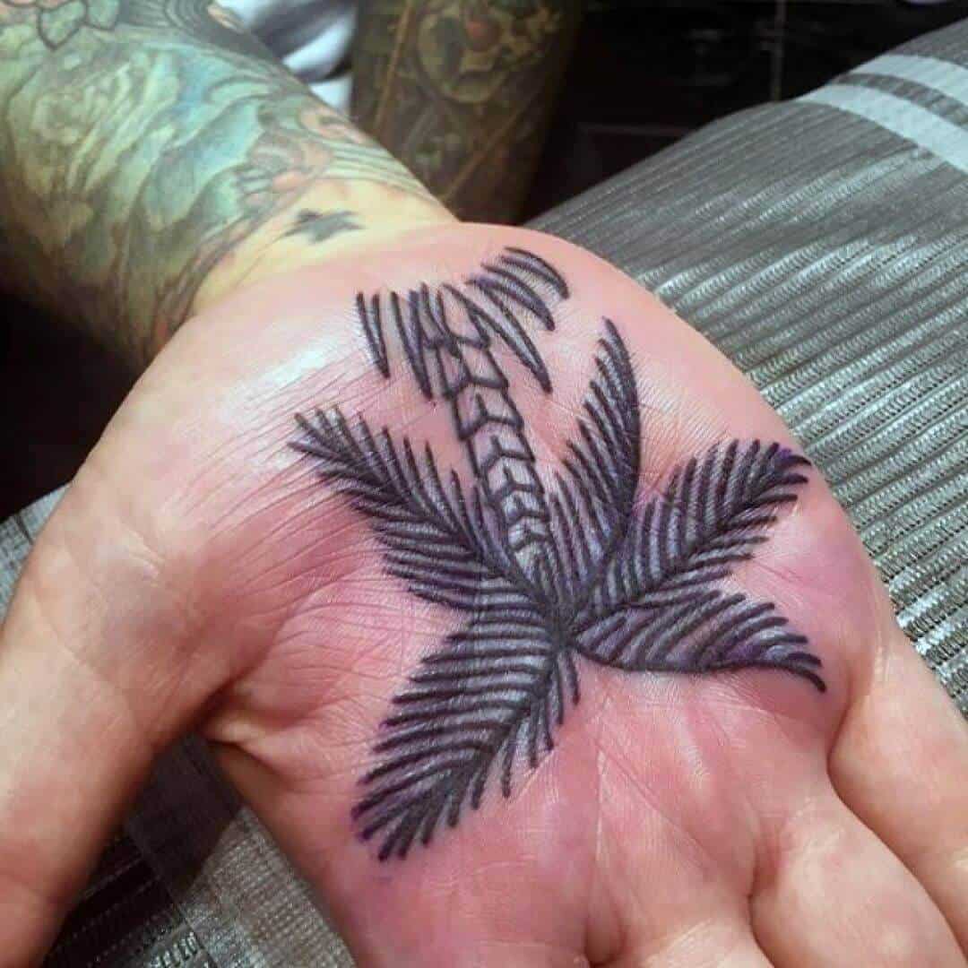 palm tree hand tattoo on palm