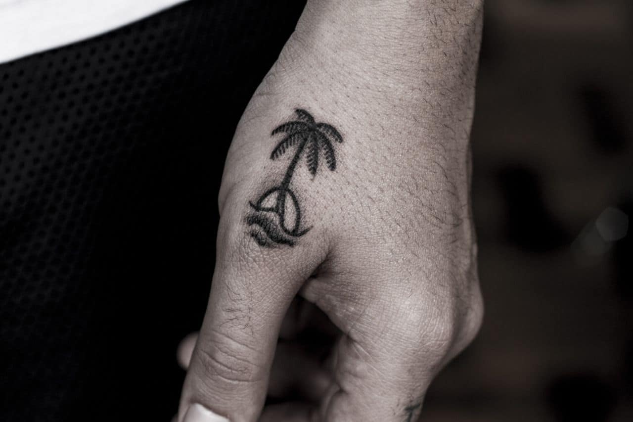 palm tree hand tattoo