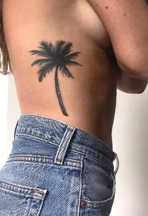 palm tree rib tattoo