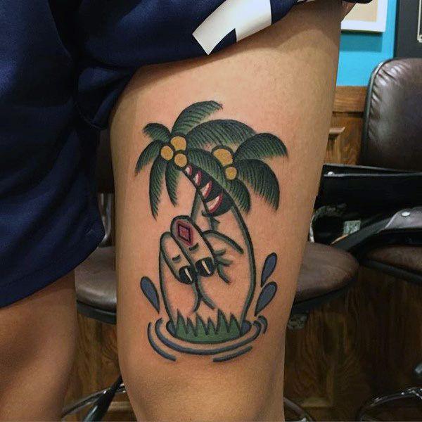 palm tree thigh tattoo