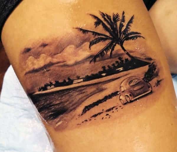palm tree thigh tattoo