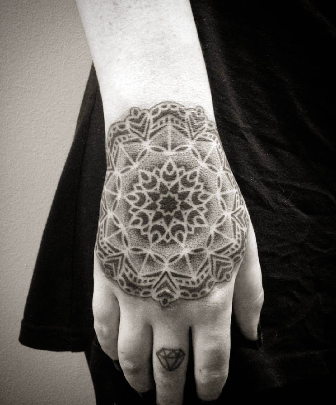 pointillism hand tattoo