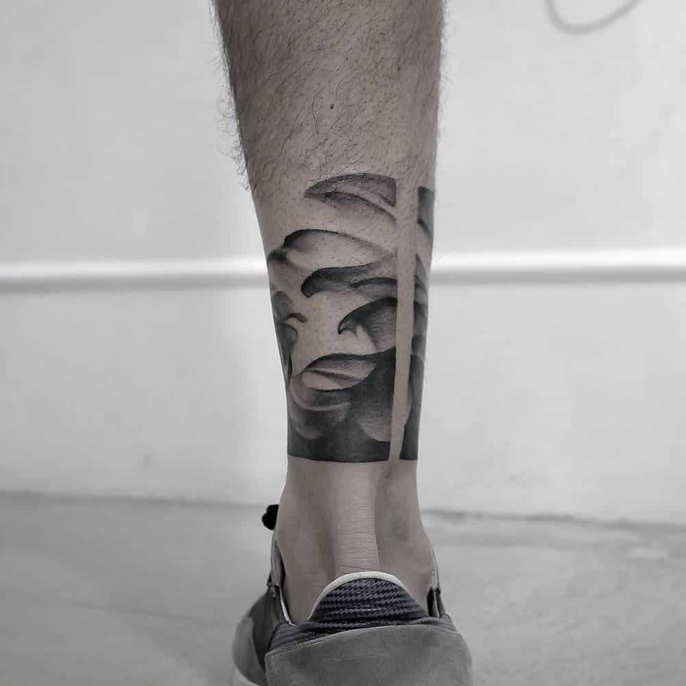 pointillism leg tattoo