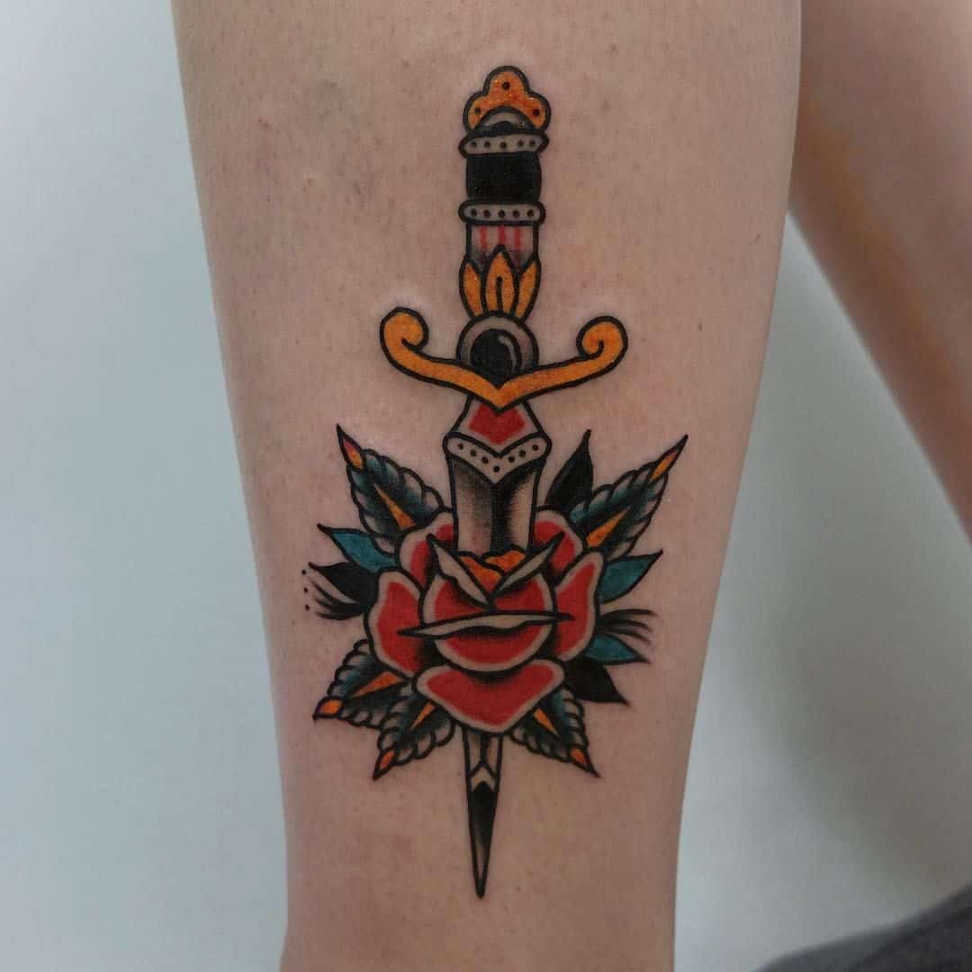 sailor jerry dagger tattoo on leg