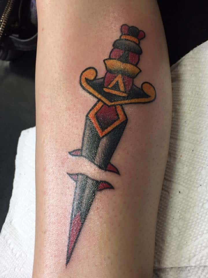 sailor jerry dagger tattoo on leg
