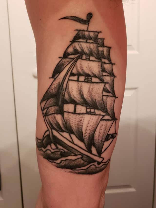 sailor jerry ship tattoo on arm
