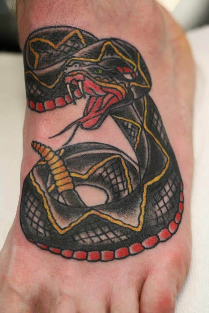 sailor jerry snake tattoo on arm