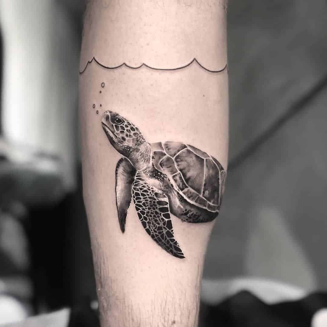 tatuagem de braço de criatura do mar