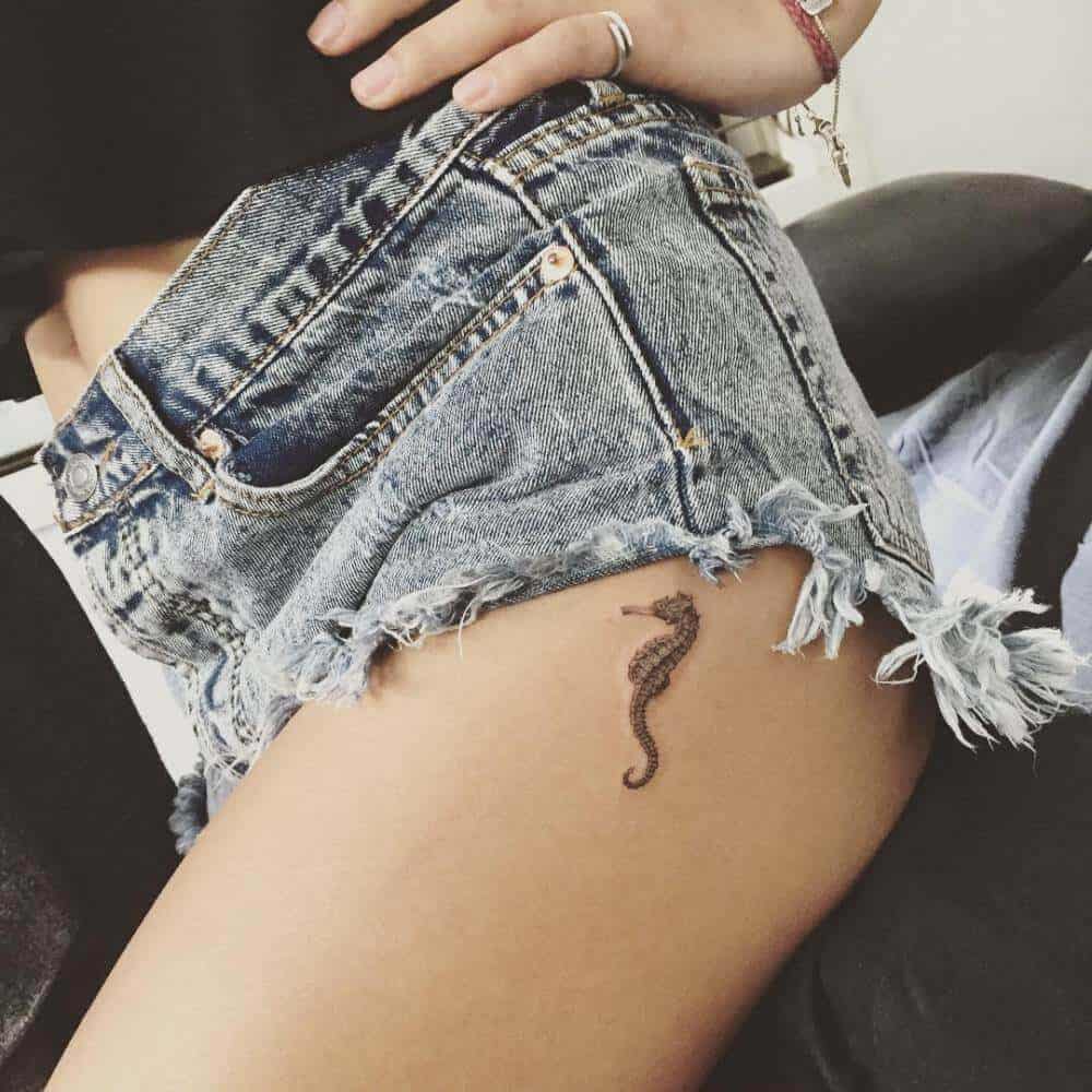 seahorse tattoo on thigh
