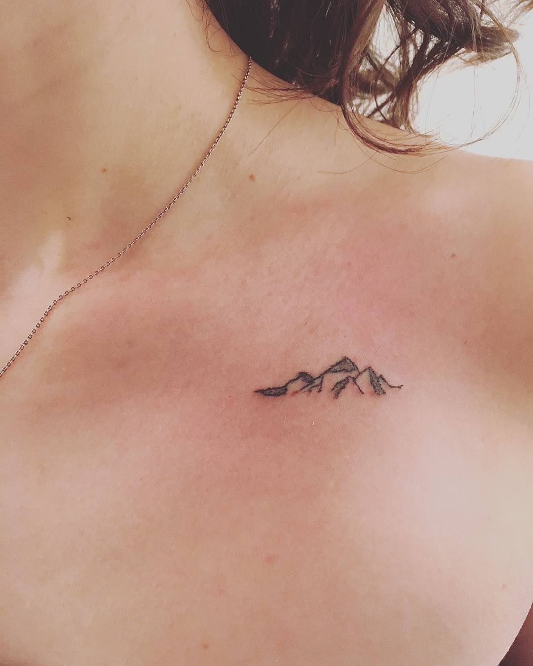 Tiny mountain range tattoo by Zaya Hastra - Tattoogrid.net