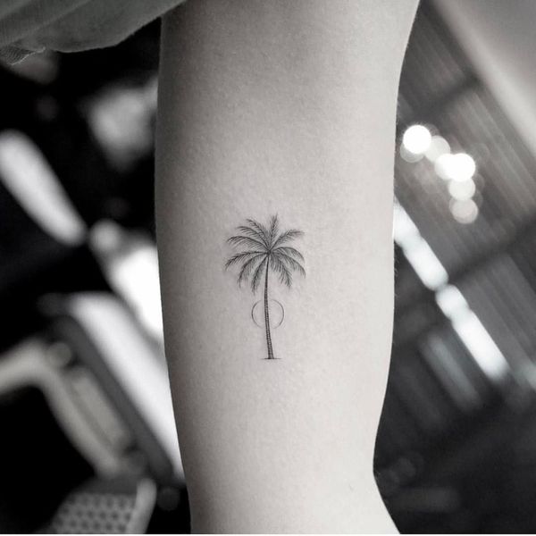 small palm tree arm tattoo