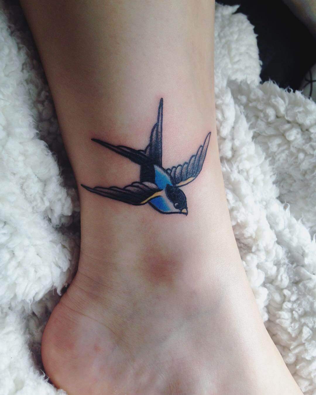 sparrow ankle tattoo