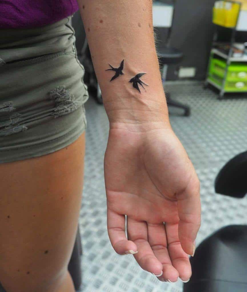 sparrow tattoo on wrist