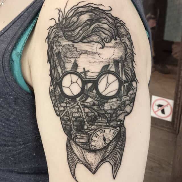 surrealism tattoo on arm