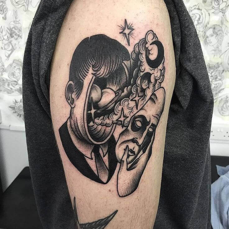 surrealism arm tattoo