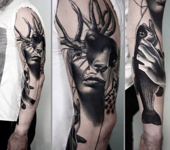 surrealism tattoo on arm