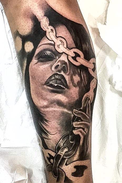 surrealism arm tattoo