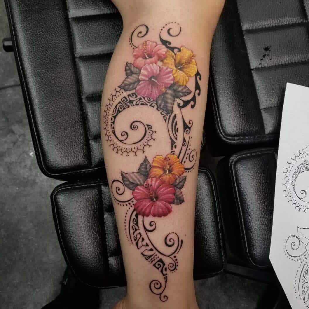 tribal hibiscus tattoo on leg