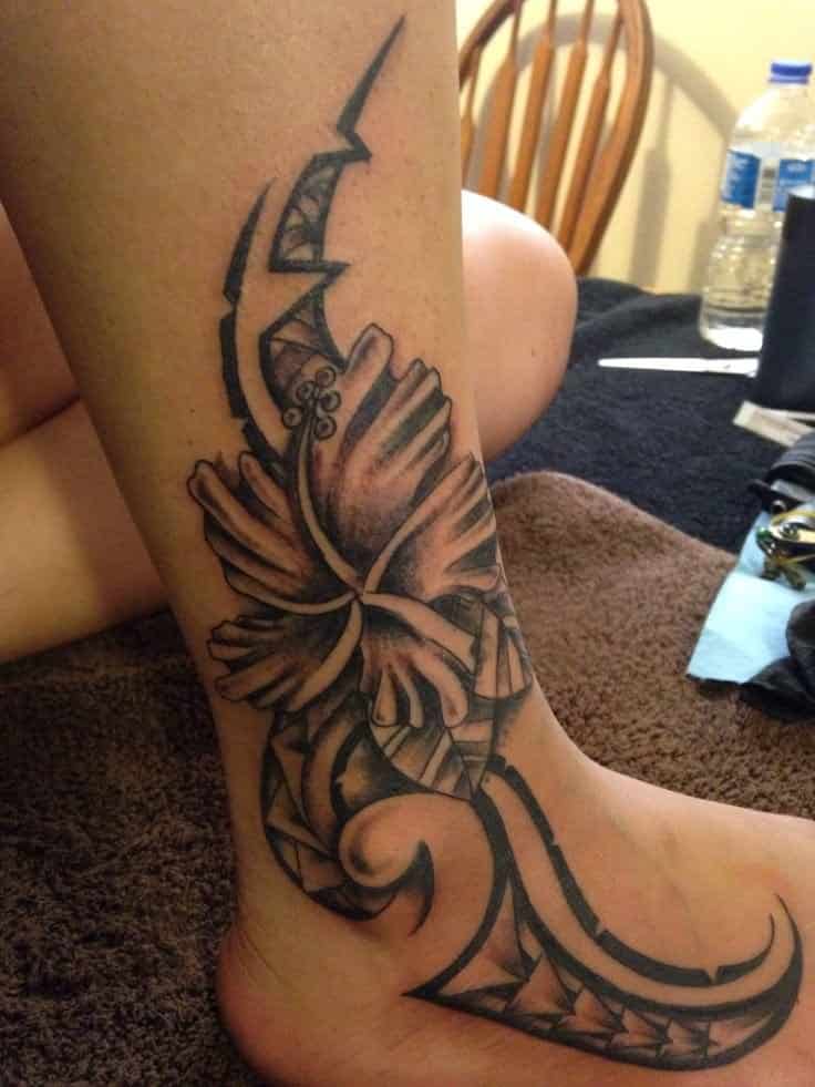 tribal hibiscus tattoo on leg